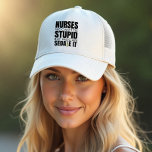 Nurses We Can't Fit Stupid Funny Design Trucker Hat<br><div class="desc">Stay shaded and stylish with our "Nurses: We Can't Fix Stupid, But We Can Sedate It" hat. This humorous saying is perfect for nurses who appreciate a good laugh. Whether you're out for a walk, running errands, or enjoying some outdoor time, this hat adds a touch of fun to your...</div>