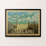 Oakland Beach Vintage Travel Jigsaw Puzzle<br><div class="desc">This Greetings From Oakland vintage postcard design features a sandy beach with a beautiful turquoise ocean water and above the sea,  a blue sky with billowy white clouds. In vintage travels style.</div>