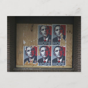 Obama signs in a boarded window of a closed postcard