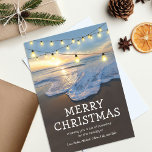 Ocean Beach Seaside Christmas Holiday Card<br><div class="desc">Beach destination christmas cards featuring a coastal shoreline,  a beautiful sunset,  string lights,  the saying 'merry christmas',  a cute holiday message,  and your names.</div>