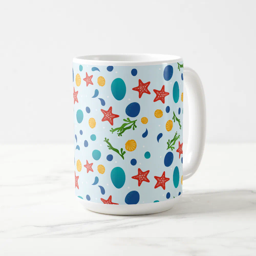 Ocean beach with starfish, shells and pebbles coffee mug