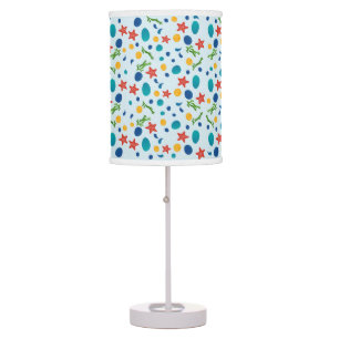 Ocean beach with starfish, shells and pebbles table lamp