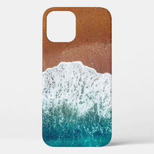 Ocean wave on a sandy beach, background top view iPhone 12 case