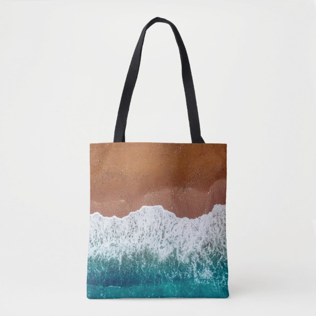 Ocean wave on a sandy beach, background  top view  tote bag (Front)