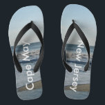 Ocean Waves Cape May New Jersey Flip Flops<br><div class="desc">Pretty Blue Sky with Light Fluffy White Clouds, Blue Sea, Crashing Ocean Waves and Beach Sand at Cape May, New Jersey fun Unisex Flip Flops. Shown with Wide Black Straps and Black Footbed. See options for flip flops in Slim Straps for more strap colors. Perfect for your summertime fun, trips...</div>