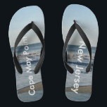 Ocean Waves Cape May Point New Jersey Flip Flops<br><div class="desc">Pretty Blue Sky with Light Fluffy White Clouds, Blue Sea, Crashing Ocean Waves and Beach Sand Unisex Flip Flops. Shown with Wide Black Straps and Black Footbed. See options for flip flops in Slim Straps for more strap colors. Perfect for your summertime fun, trips to the beach, vacations, honeymoon or...</div>