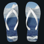 Ocean Waves Fluffy White Clouds Blue Sky Flip Flops<br><div class="desc">My Original Photography Design. Pretty Blue Sky with Fluffy White Clouds, Blue Sea and White Foam Ocean Waves Unisex Flip Flops. Click CUSTOMIZE IT to Personalize with your name or text. Shown with Wide White Straps and White Footbed. Choose your style flip flops from options (Slim Straps comes in different...</div>