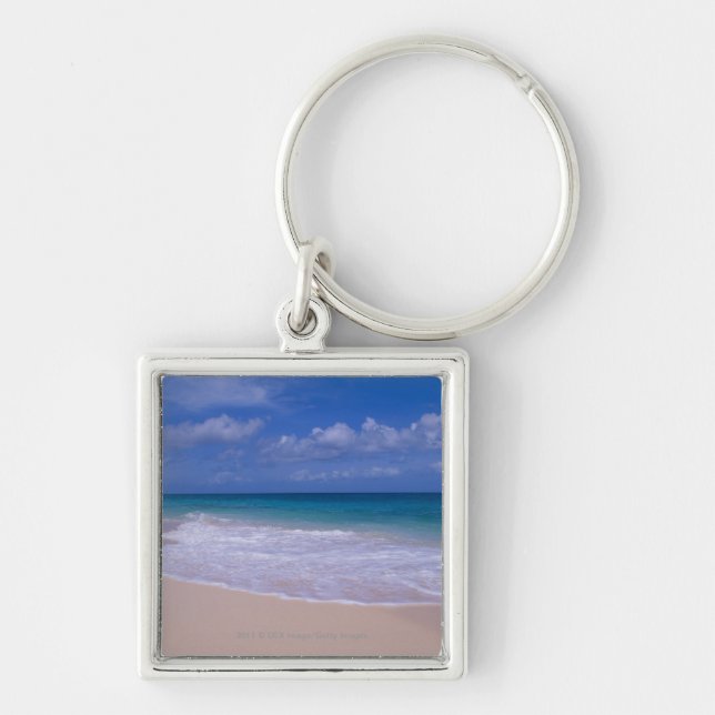 Ocean waves foaming onto sandy beach keychain (Front)