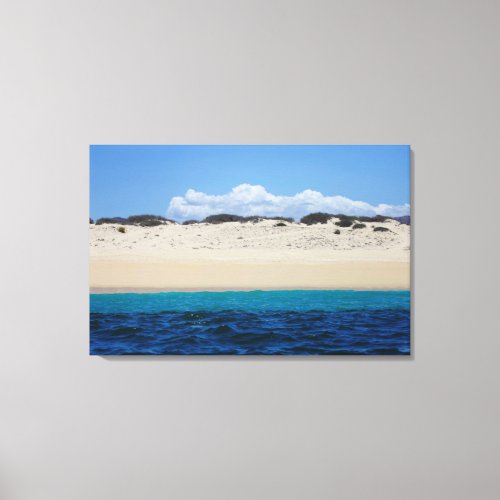 Ocean Waves On Sandy Beach Under Blue Sky Canvas Print