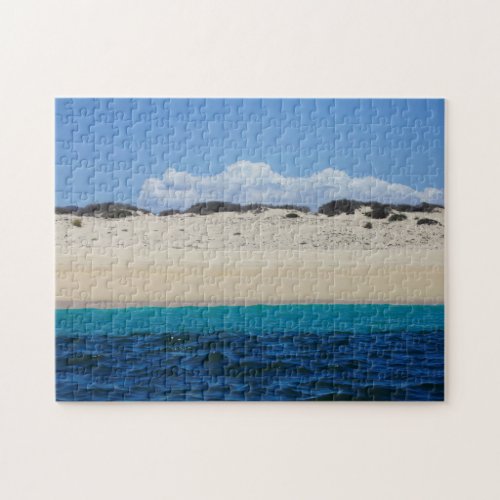 Ocean Waves On Sandy Beach Under Blue Sky Jigsaw Puzzle