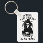October Is My Therapy, Spooky Is My Peace Keychain<br><div class="desc">A bold gothic-style artwork featuring a mysterious witch in sunglasses,  framed by pumpkins,  bats,  and candlelight. This monochrome design captures the magic and mystery of October,  perfect for those who find peace in spooky season vibes.</div>