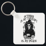 October Is My Therapy, Spooky Is My Peace Keychain<br><div class="desc">A bold gothic-style artwork featuring a mysterious witch in sunglasses,  framed by pumpkins,  bats,  and candlelight. This monochrome design captures the magic and mystery of October,  perfect for those who find peace in spooky season vibes.</div>