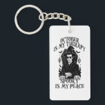 October Is My Therapy, Spooky Is My Peace Keychain<br><div class="desc">A bold gothic-style artwork featuring a mysterious witch in sunglasses,  framed by pumpkins,  bats,  and candlelight. This monochrome design captures the magic and mystery of October,  perfect for those who find peace in spooky season vibes.</div>