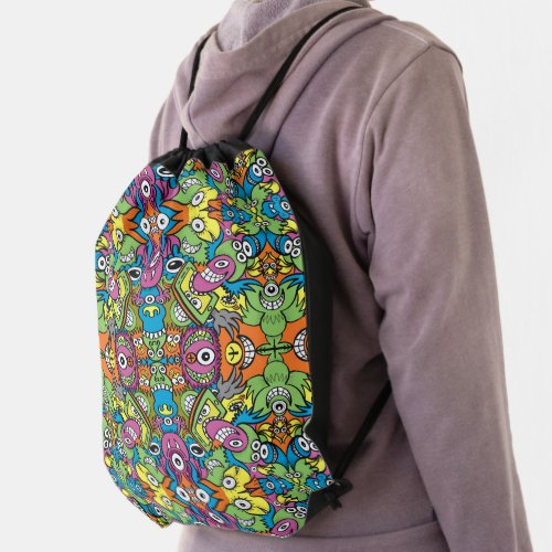 Odd smiling critters in a whimsical pattern design drawstring bag