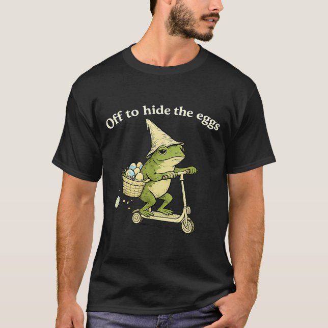Off to Hide the Eggs Funny Frog Scooter Easter Day T-Shirt (Front)