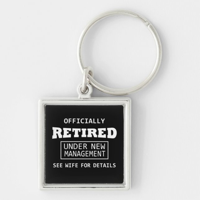 officially retired under new management keychain (Front)