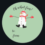 Oh what Fun Christmas Snowman stick on gift tag<br><div class="desc">A cute minimal Christmas design that features a naive digital painting of a snowman wearing matching red hat, scarf and mittens on a sage green background with the text: Oh What Fun! and a place for you to add the giver and recipient names with a sharpie. You can customize the...</div>