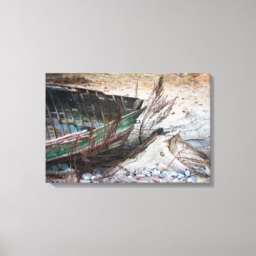 Old Abandoned Wooden Boat and Driftwood on Beach Canvas Print