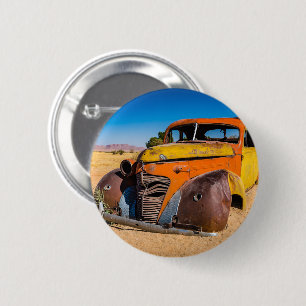 Old and abandoned car in Solitaire, Namibia Button