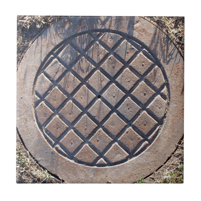 Old and rusty manhole tile (Front)