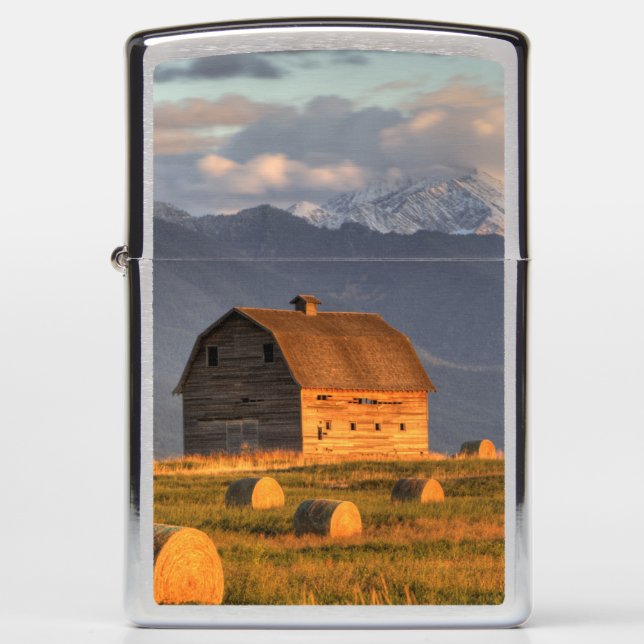Old barn framed by hay bales and dramatic zippo lighter (Front)