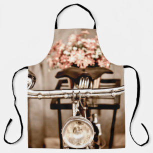Old bicycle and flowers blur in background process apron