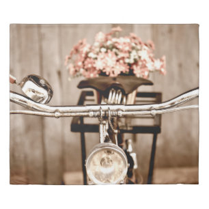 Old bicycle and flowers blur in background process duvet cover
