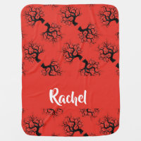 Old black trees on red baby blanket