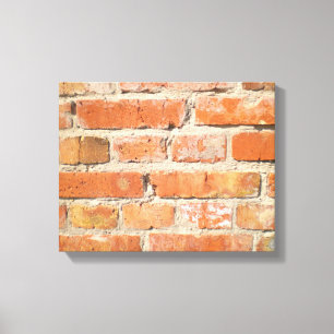 Old brick wall with peeling cladding canvas print