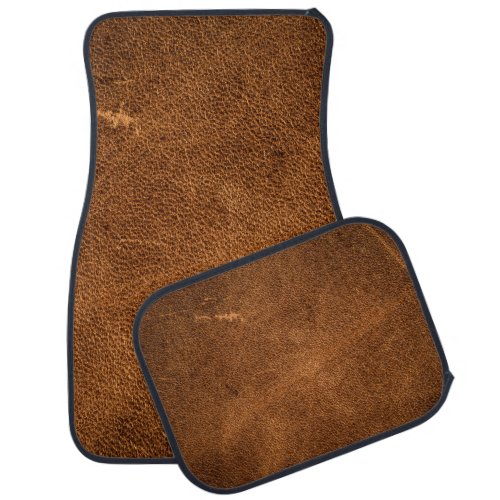 Old brown leather car floor mat