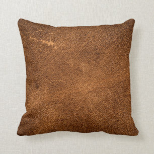 Old brown leather throw pillow