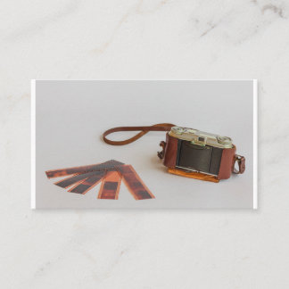old camera with negative on business card