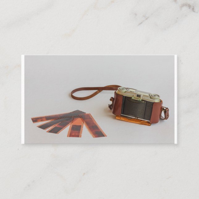 old camera with negative on   business card (Front)
