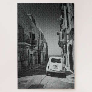 Old car in a street in Italy in black and white Jigsaw Puzzle