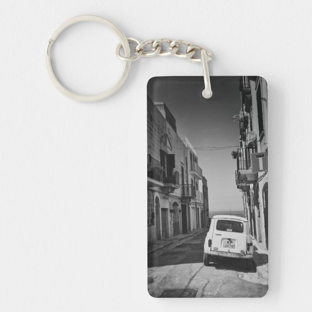 Old car in a street in Italy with sea Keychain (Front)