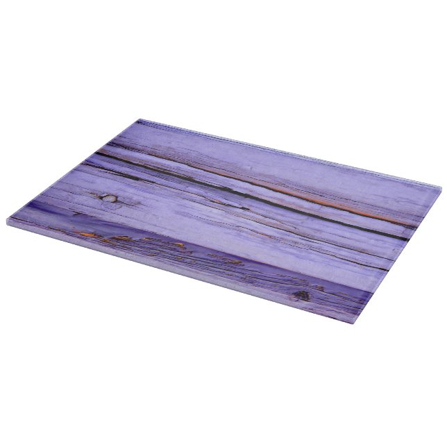 Old cracked purple paint on wood cutting board (Corner)