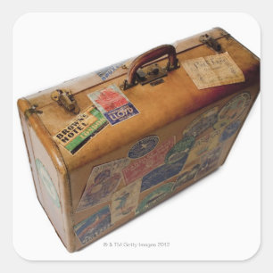 old fashioned suitcase with travel stickers