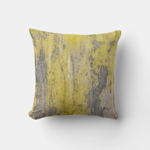 Old gray concrete wall with peeling yellow paint. throw pillow