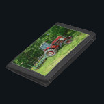 Old International Tractor Tri-fold Wallet<br><div class="desc">An older International Tractor with a Seeding/Spreader Trailer sits in a field near Fair Grove, Missouri. This is my photo that has been turned into a painting. Looking for more prints or products? Feel free to visit my store: http://www.zazzle.com/timelessmomentsphtgy This photo was taken by Jennifer White with Timeless Moments Photography....</div>