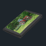 Old International Tractor Tri-fold Wallet<br><div class="desc">An older International Tractor with a Seeding/Spreader Trailer sits in a field near Fair Grove, Missouri. This is my photo that has been turned into a painting. Looking for more prints or products? Feel free to visit my store: http://www.zazzle.com/timelessmomentsphtgy This photo was taken by Jennifer White with Timeless Moments Photography....</div>