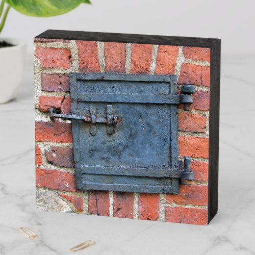 Old Iron Door on Red Brick Wall Wooden Box Sign
