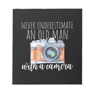 Old Man With A Camera Notepad