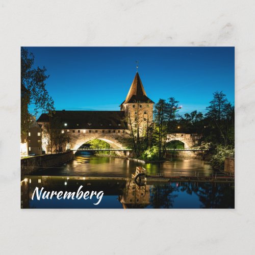 Old mediaeval bridge at night in Nuremberg Postcard