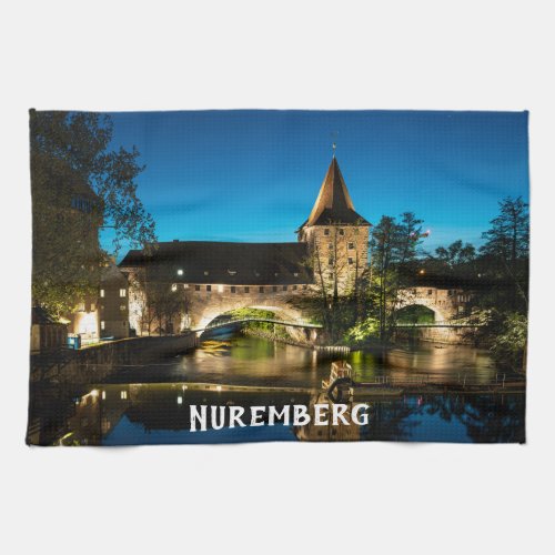 Old medieval bridge at night in Nuremberg Kitchen Towel