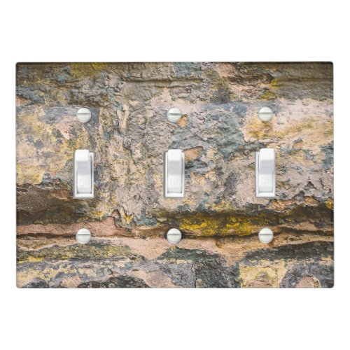 Old painted brick wall  light switch cover