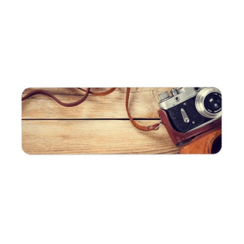 Old Retro Camera On Wooden Table Background Label