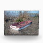 Old Rustic Row Boat Award<br><div class="desc">This is a scenic photo of a small red and white row boat that has become part of the landscape. It is located on a small beach area at the Jersey shore in New Jersey. Phragmites grow just beyond the old wooden boat, obscuring the blue sky and Barnegat Bay in...</div>