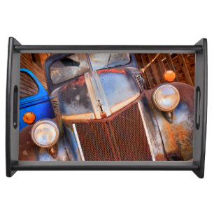 Old rusty truck on a farm serving tray