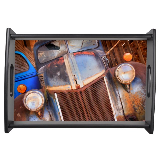 Old rusty truck on a farm serving tray (Front)