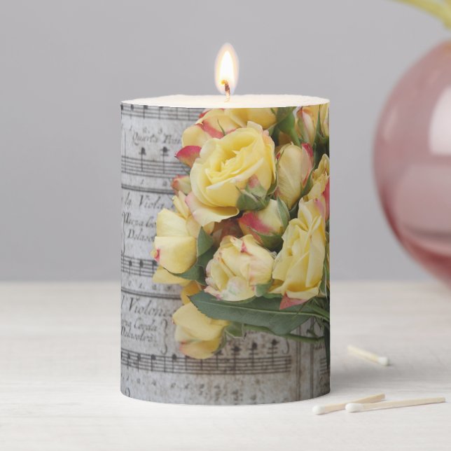 Old sheet music with yellow roses pillar candle (In Situ)